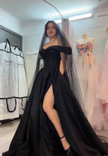 Load image into Gallery viewer, Alina off shoulder black wedding dress with slit and pockets .

