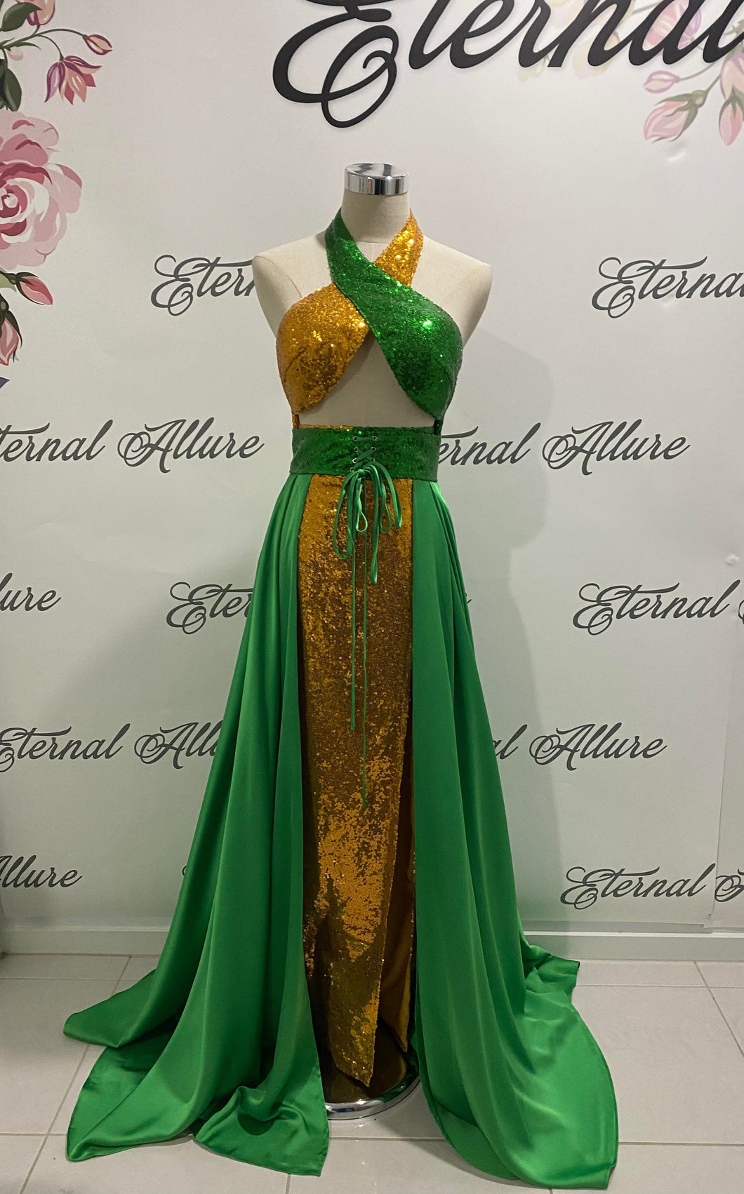 Cindy Green and gold dress